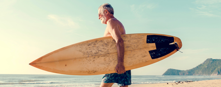 seniors retiring in hawaii surfboard