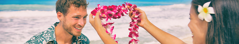 haole Woman hanging a lai on ha'ole man