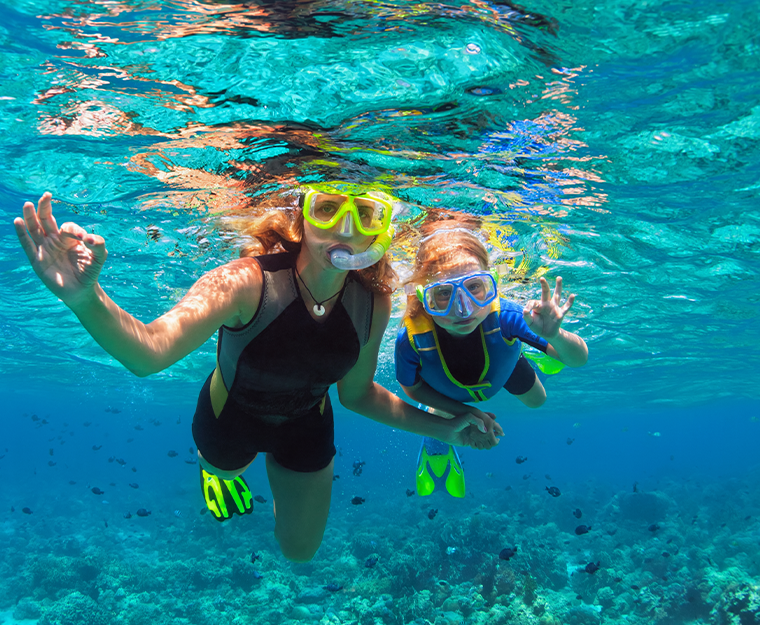 mom and daughter snorkel in hawaii