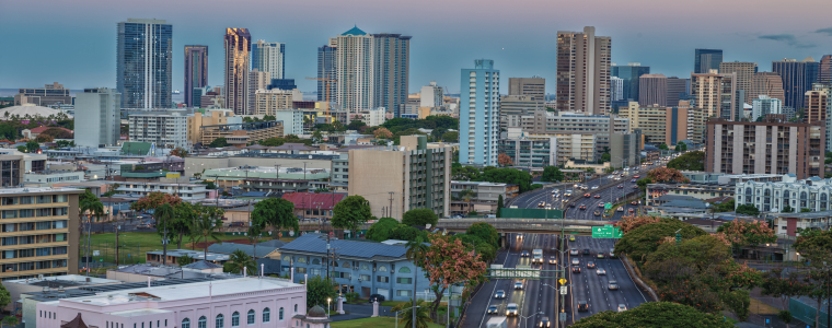 Honolulu, Hawaii, USA. June 27, 2024. Above Honolulu as viewed at dawn as traffic flows on the H-1 Freeway.