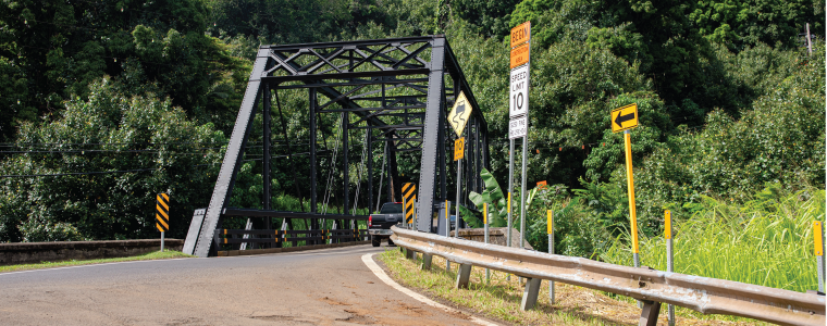 Hanalei, Kauai US - July 27, 2024: Old historic metal and wood bridge on the road to Hanalei from Princeville in Kauai, Hawaii, sunny day, one of Kauai’s most recognizable man-made landmarks